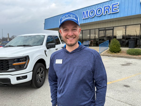 Moore Automotive Team member outside the dealership